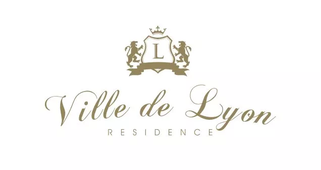 Logo do Ville de Lyon Residence, da Macom Construtora e Incorporadora